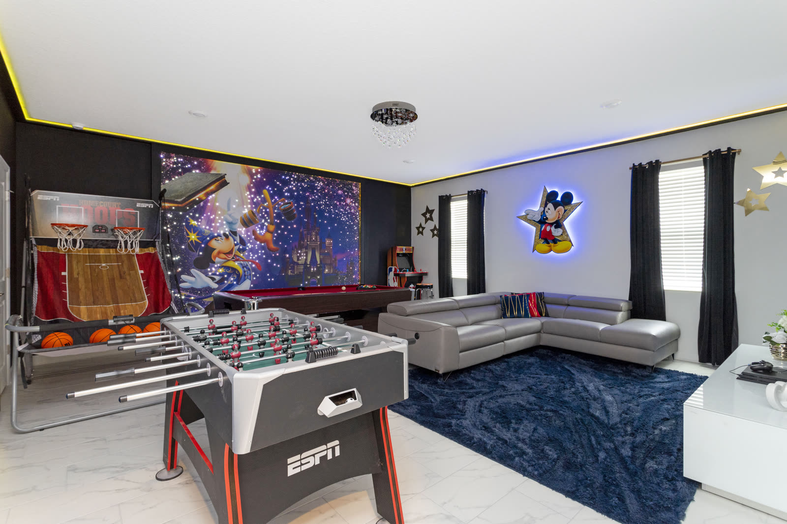 Mickey Fantasia game room with pool table, foosball, and basketball arcade at The Disney Villa