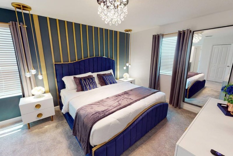 King suite with blue velvet channel headboard