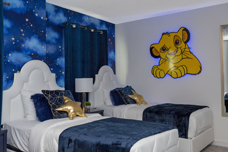 Lion King themed kids' room with three single beds
